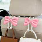 2PCS Bow Pearl Car Seat Headrest Hook, Cute Vehicle Seat Hangers Storage Organizer for Handbag Purse Coat, Auto Interior Headrest Decorative Hook, Universal for SUV RV Truck (Pink)