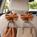 2 Pack Car Purse Holder for Handbags and Bags, Headrest Back Seat Hooks for Cars, Car Bag Hanger for Groceries, Coats, Umbrellas and Daily Essentials, Bow-Shaped Car Interior Organizer (brown)