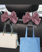 2 Pack Car Purse Holder for Handbags and Bags, Headrest Back Seat Hooks for Cars, Car Bag Hanger for Groceries, Coats, Umbrellas and Daily Essentials, Bow-Shaped Car Interior Organizer (Leather pink)
