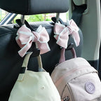 Car Seat Headrest Hook Cute Bowknot Vehicle Hanger Car Storage Organizer for Handbag Purse Coat Grocery Bag Black Pink
